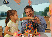 Photo of a little girl and a doctor playing in the children's waiting room. Link to Gifts of Appreciated Securities. securities.jpg